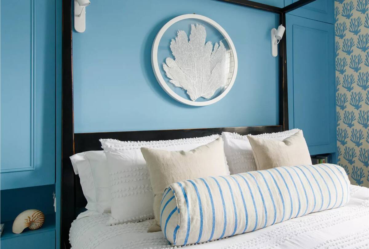 four-poster bed in blue room
