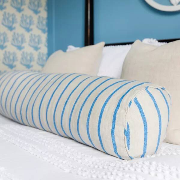 Bed soft furnishings in blue room