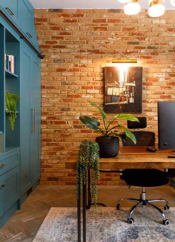 Home office with brick feature wall